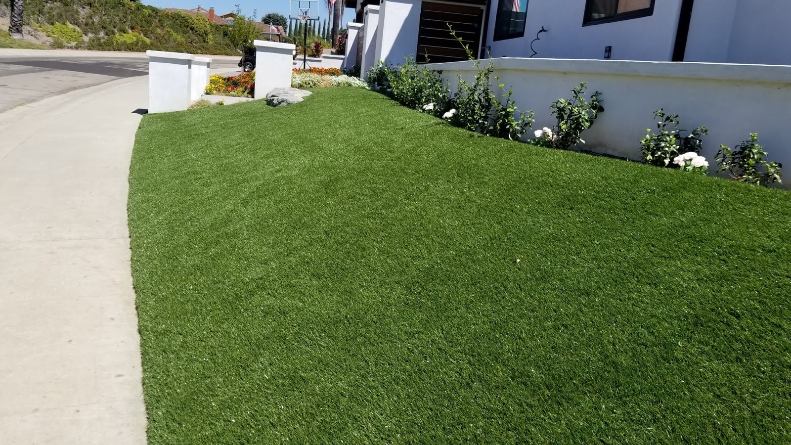How To Install Artificial Grass On A Steep Slope In Del Mar?